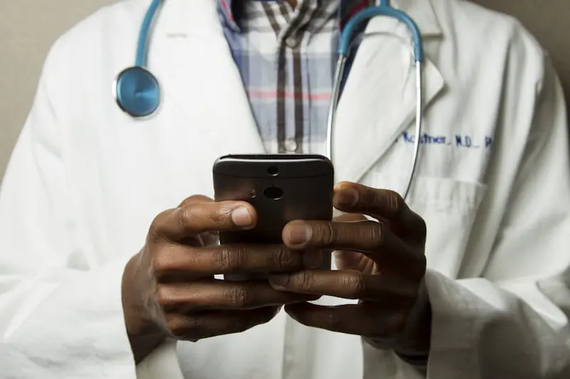 Doctor using a smartphone in a clinical setting